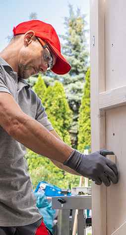 Technician working on a garage door