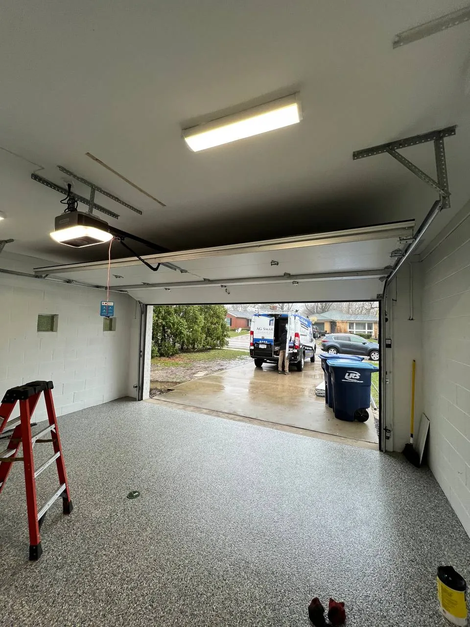 Technician servicing a garage door