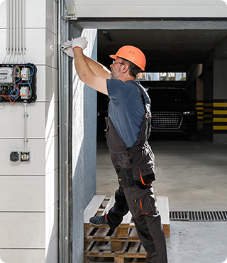 Technician fixing a garage door